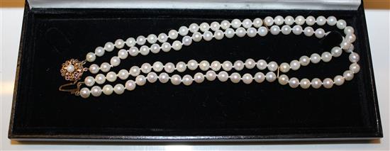 A Mikimoto double strand cultured pearl necklace with 9ct gold clasp